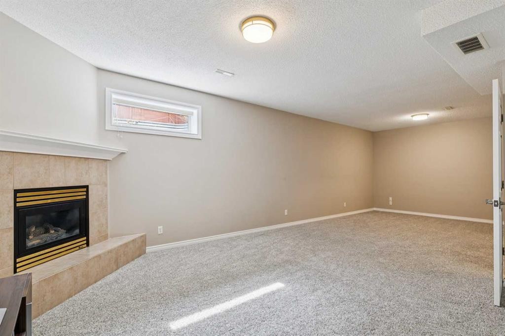 113 Westchester Way, Chestermere, AB - Indoor With Fireplace
