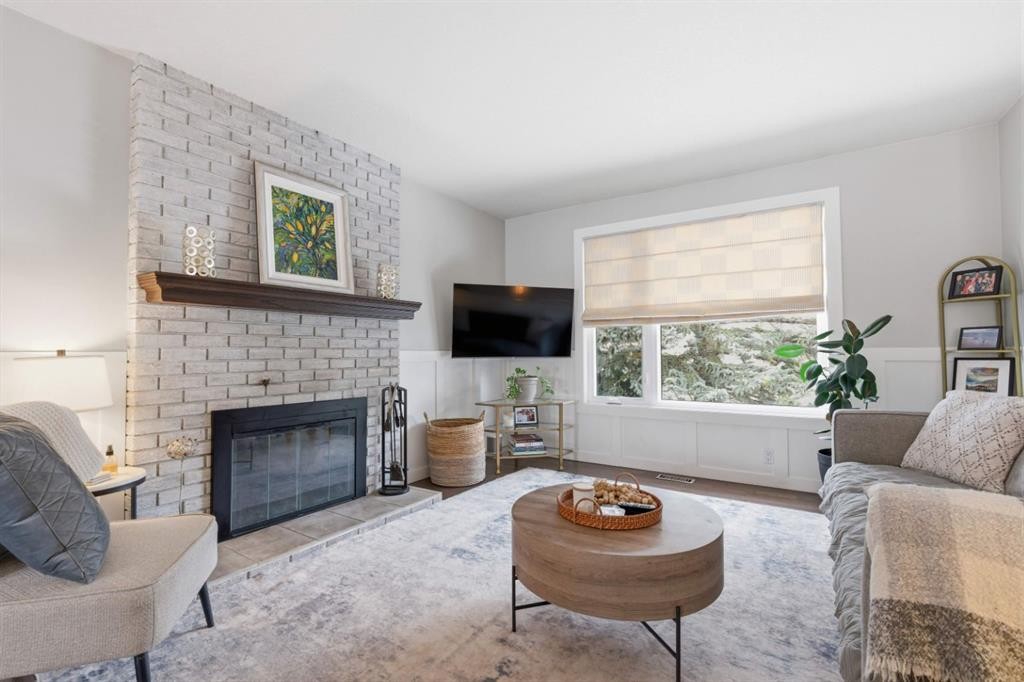 8411 Silver Springs Road Nw, Calgary, AB - Indoor Photo Showing Living Room With Fireplace