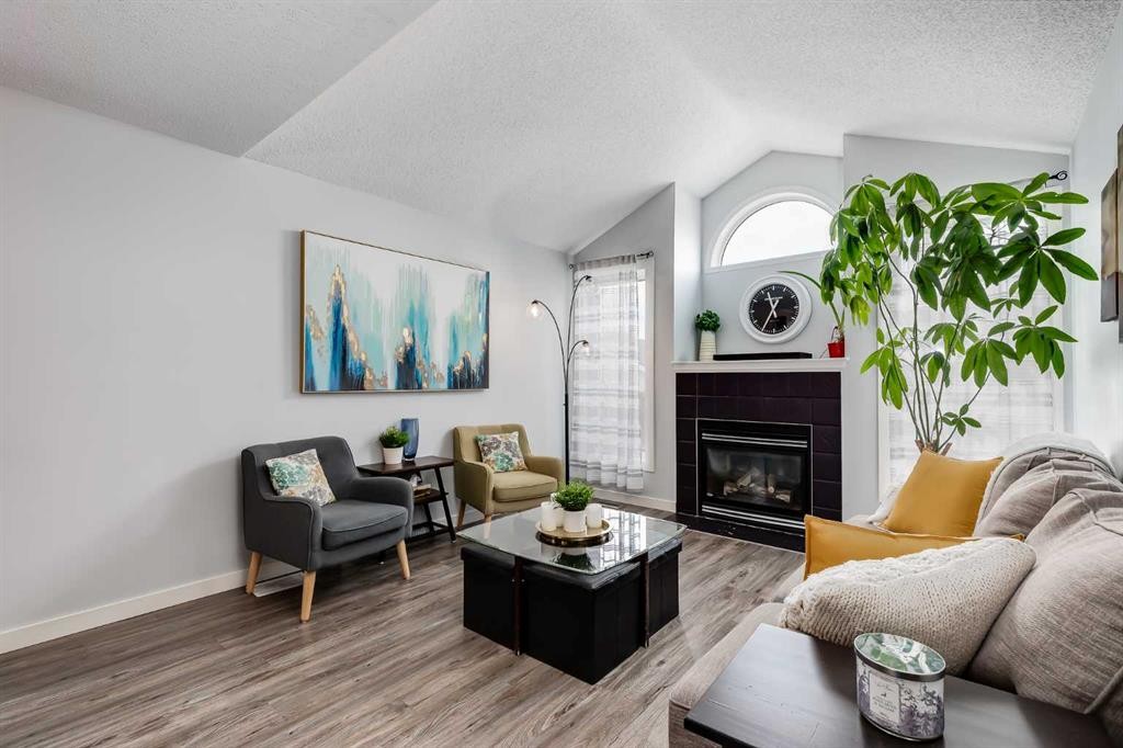 138 Prestwick Circle Se, Calgary, AB - Indoor Photo Showing Living Room With Fireplace
