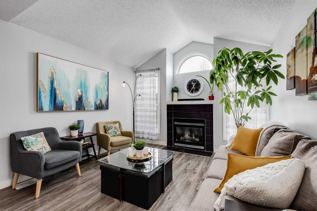 138 Prestwick Circle Se, Calgary, AB - Indoor Photo Showing Living Room With Fireplace