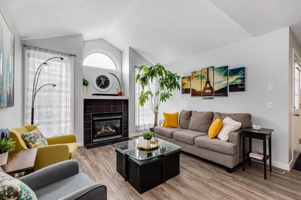138 Prestwick Circle Se, Calgary, AB - Indoor Photo Showing Living Room With Fireplace