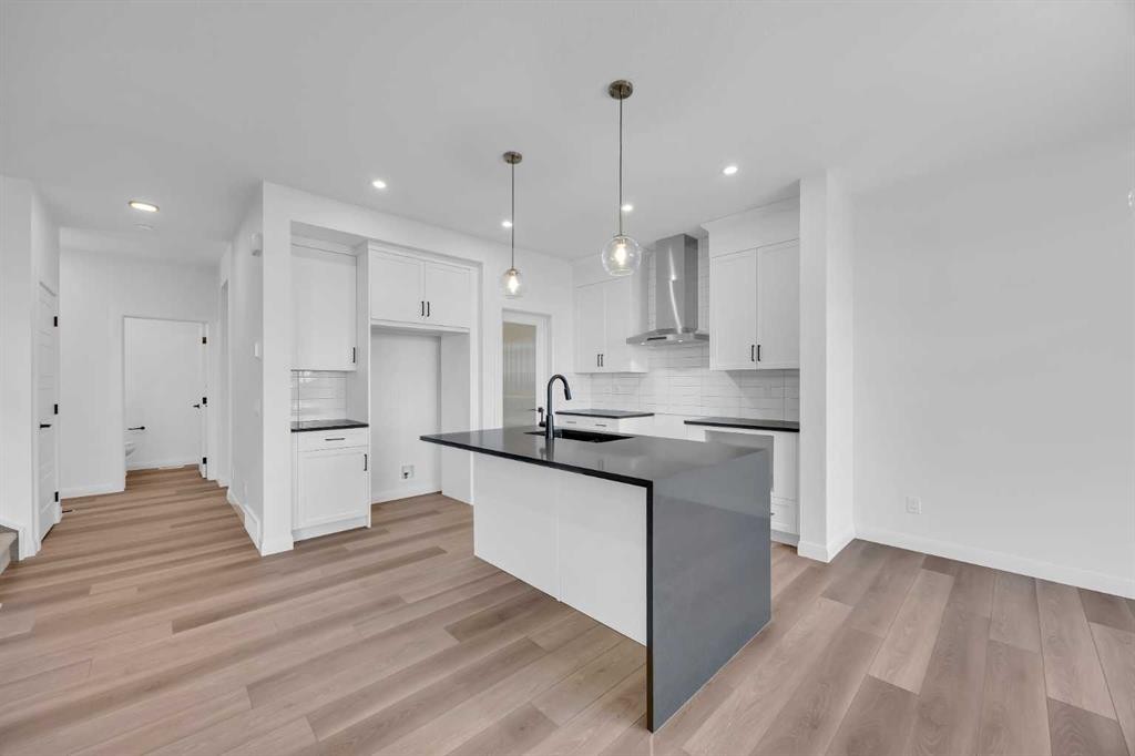 154 Northern Lights Crescent, Langdon, AB - Indoor Photo Showing Kitchen With Upgraded Kitchen