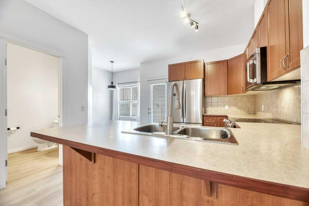 109 Ranch Ridge Meadow, Strathmore, AB - Indoor Photo Showing Kitchen With Double Sink