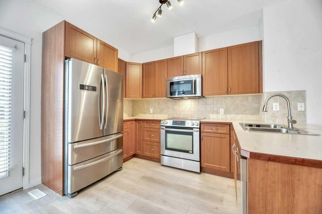 109 Ranch Ridge Meadow, Strathmore, AB - Indoor Photo Showing Kitchen With Double Sink