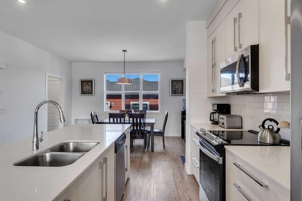 178 Dawson Way, Chestermere, AB - Indoor Photo Showing Kitchen With Double Sink