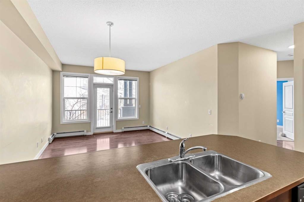212-10 Panatella Road Nw, Calgary, AB - Indoor Photo Showing Kitchen With Double Sink