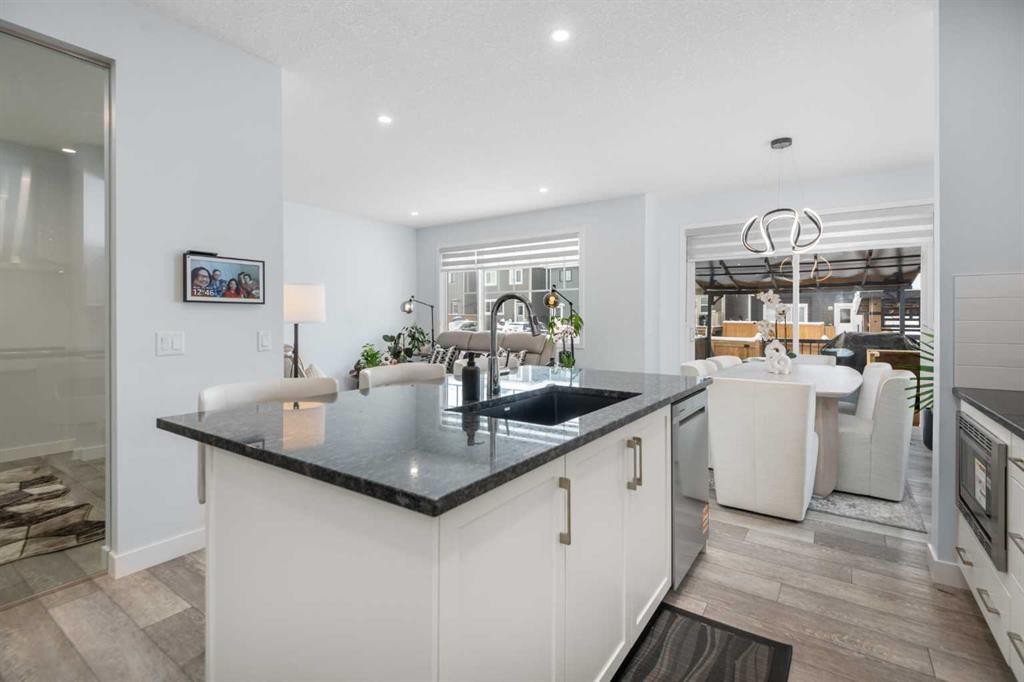 158 Magnolia Path Se, Calgary, AB - Indoor Photo Showing Kitchen With Upgraded Kitchen