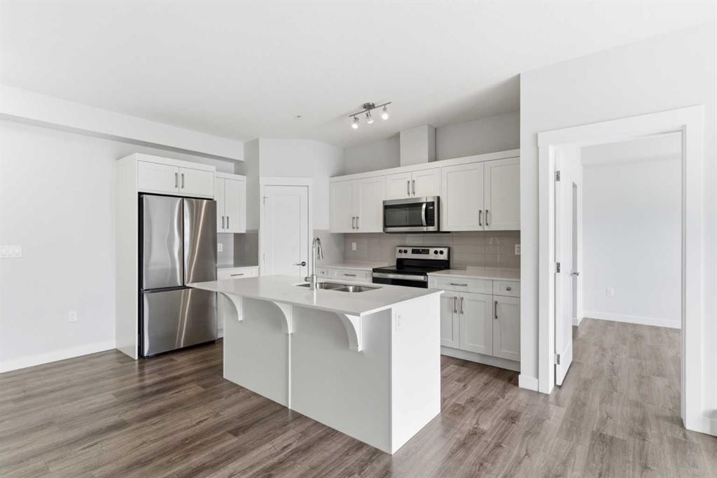 211-25 Walgrove Walk Se, Calgary, AB - Indoor Photo Showing Kitchen With Stainless Steel Kitchen With Double Sink