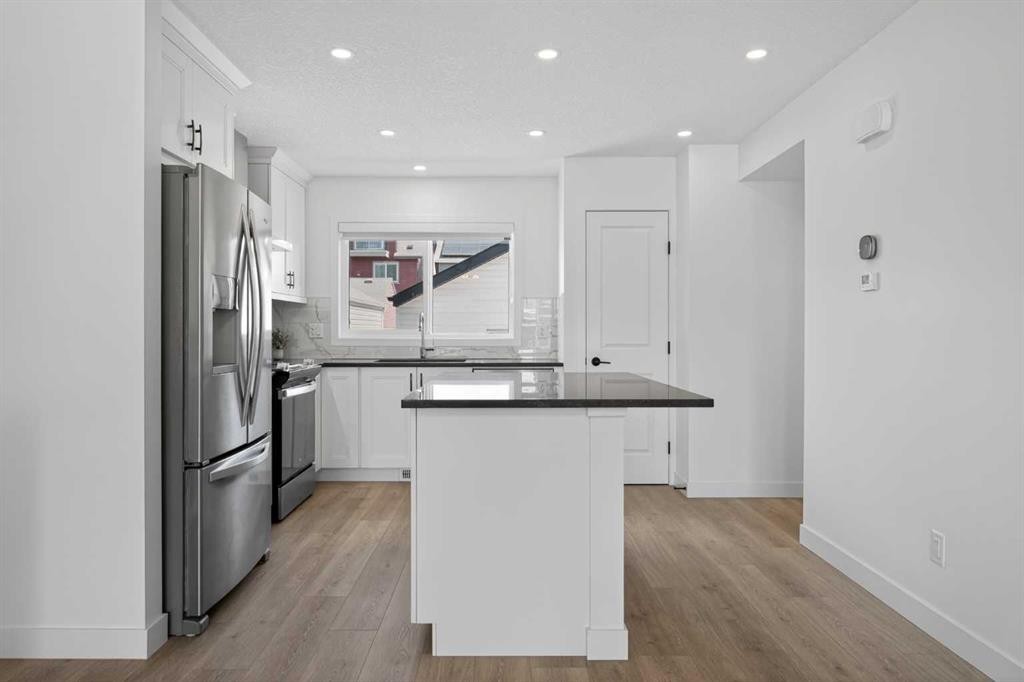 12 Heirloom Crescent Se, Calgary, AB - Indoor Photo Showing Kitchen With Upgraded Kitchen