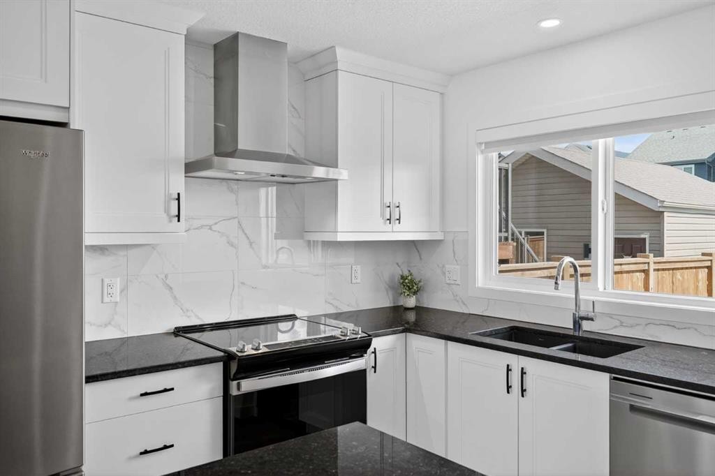 12 Heirloom Crescent Se, Calgary, AB - Indoor Photo Showing Kitchen With Double Sink
