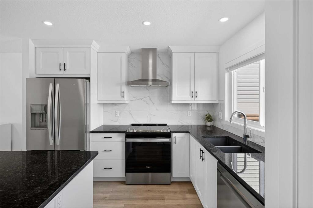 12 Heirloom Crescent Se, Calgary, AB - Indoor Photo Showing Kitchen With Double Sink With Upgraded Kitchen