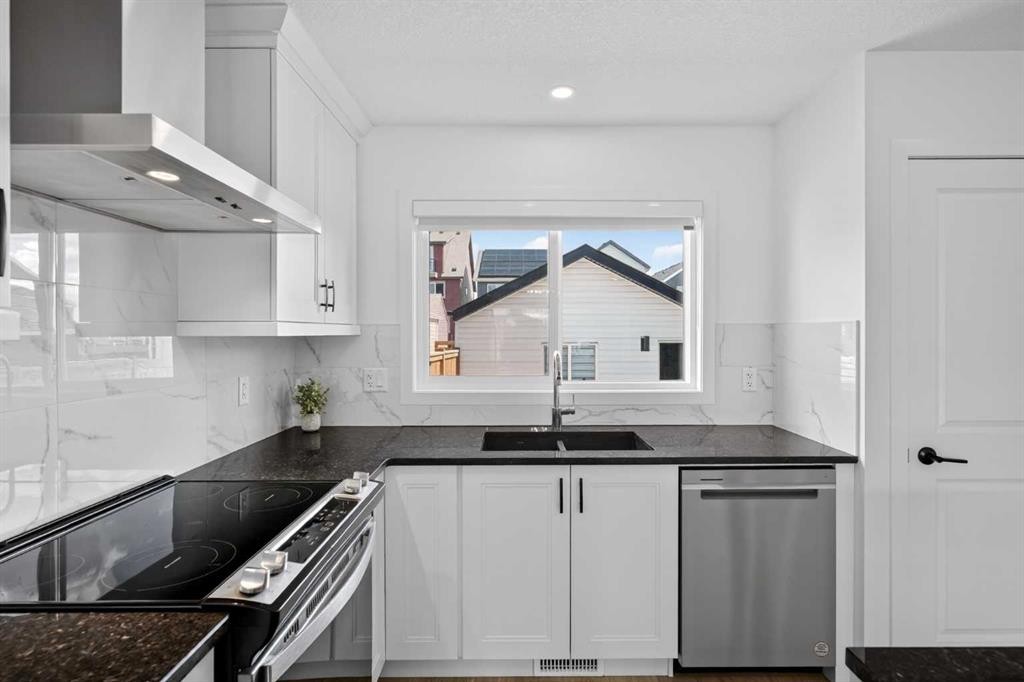 12 Heirloom Crescent Se, Calgary, AB - Indoor Photo Showing Kitchen With Double Sink
