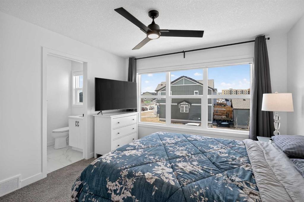 12 Heirloom Crescent Se, Calgary, AB - Indoor Photo Showing Bedroom