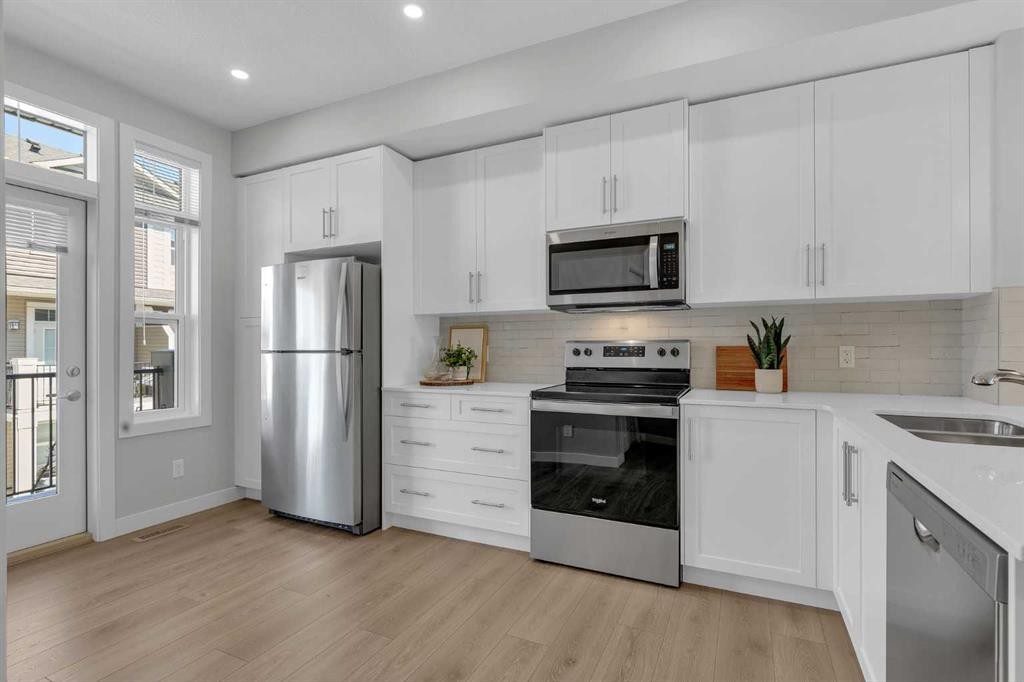 118 Legacy Path Se, Calgary, AB - Indoor Photo Showing Kitchen With Stainless Steel Kitchen With Double Sink