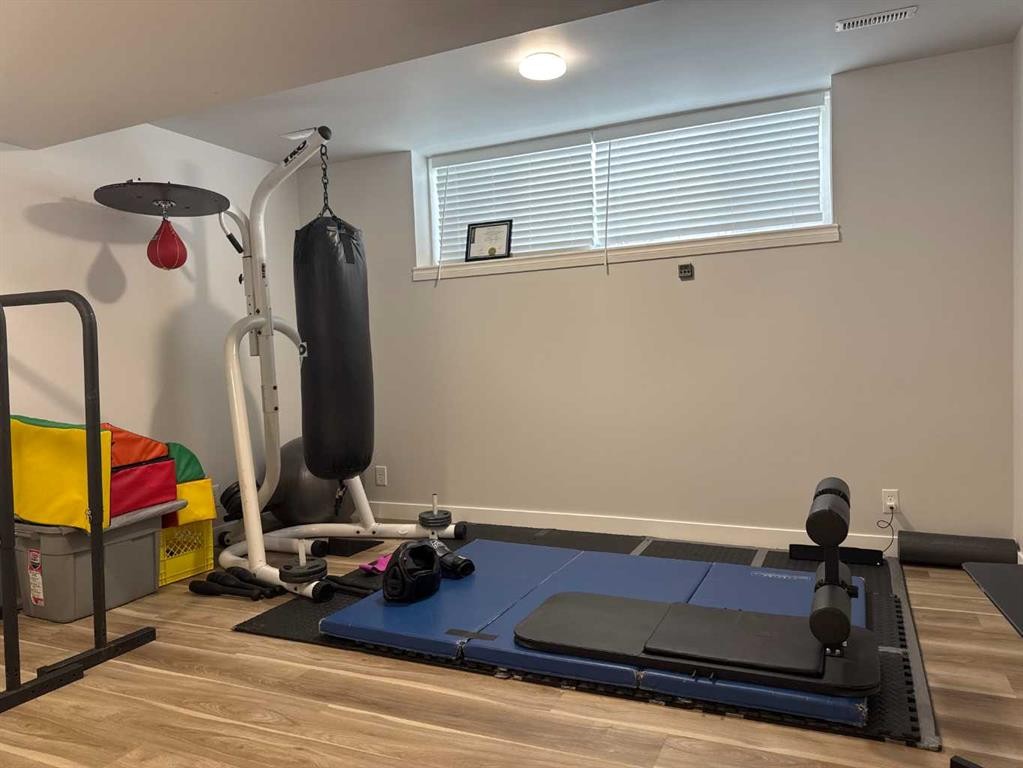 8-304 Ross Avenue, Cochrane, AB - Indoor Photo Showing Gym Room