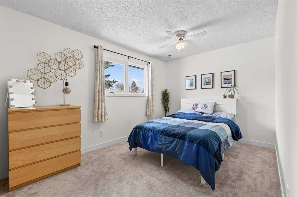584 Woodhill Place Sw, Calgary, AB - Indoor Photo Showing Bedroom