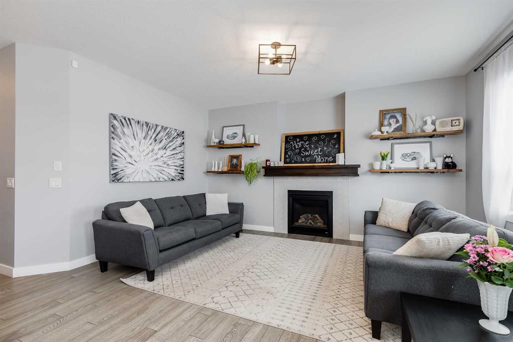 230 Nolanhurst Bay Nw, Calgary, AB - Indoor Photo Showing Living Room With Fireplace