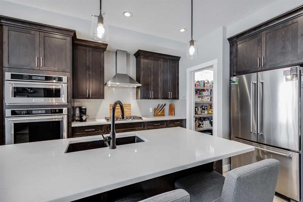 230 Nolanhurst Bay Nw, Calgary, AB - Indoor Photo Showing Kitchen With Stainless Steel Kitchen With Double Sink With Upgraded Kitchen