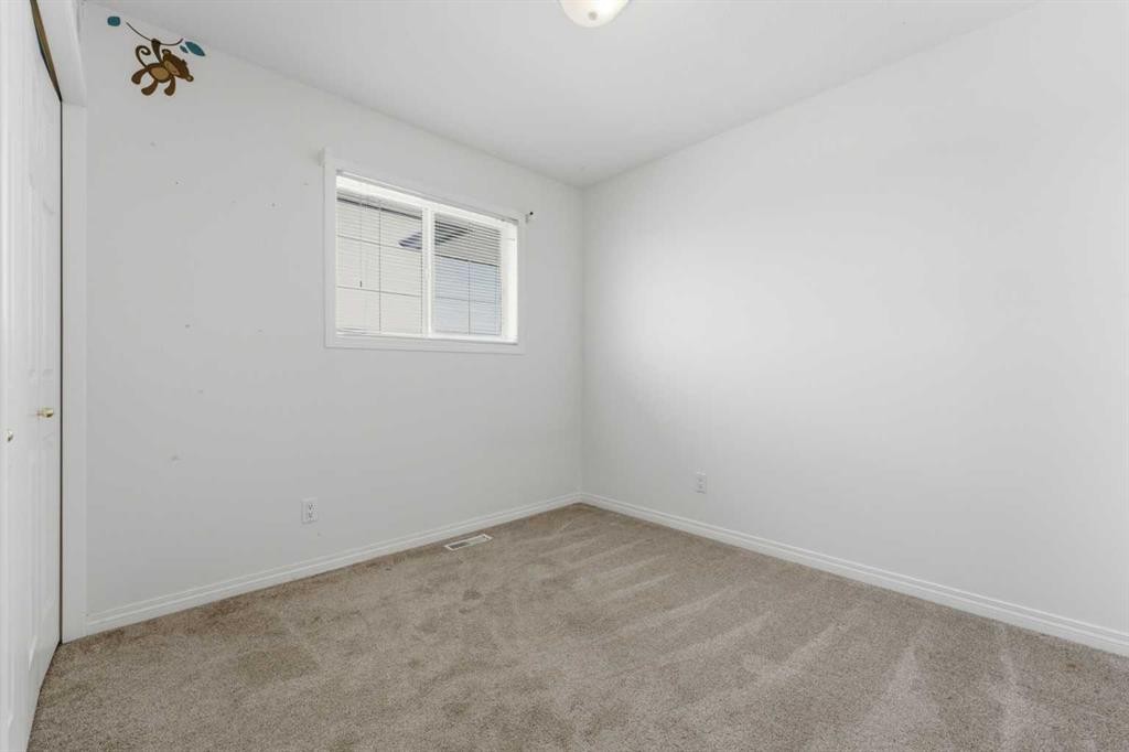 1-12 Silver Creek Boulevard Nw, Airdrie, AB - Indoor Photo Showing Other Room