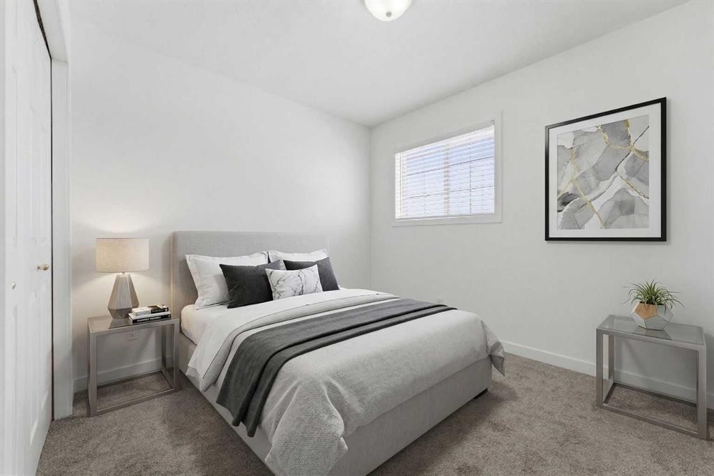 1-12 Silver Creek Boulevard Nw, Airdrie, AB - Indoor Photo Showing Bedroom