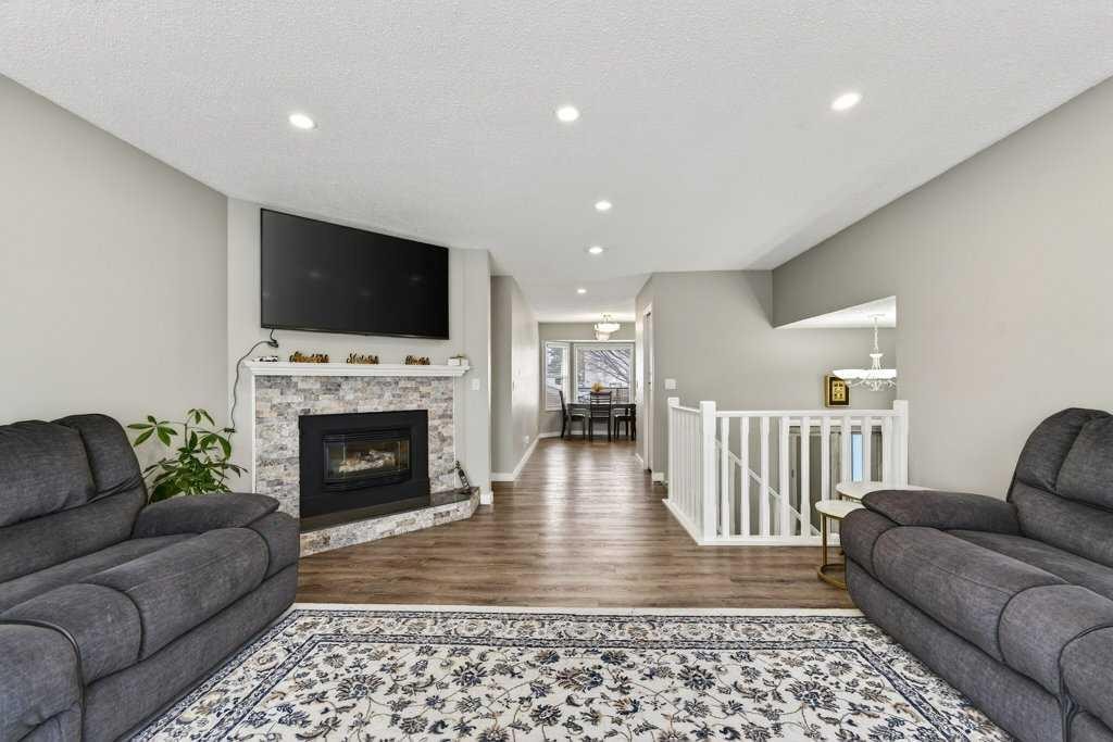96 Templehill Drive Ne, Calgary, AB - Indoor Photo Showing Living Room With Fireplace