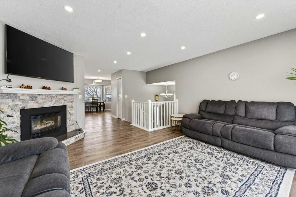 96 Templehill Drive Ne, Calgary, AB - Indoor Photo Showing Living Room With Fireplace