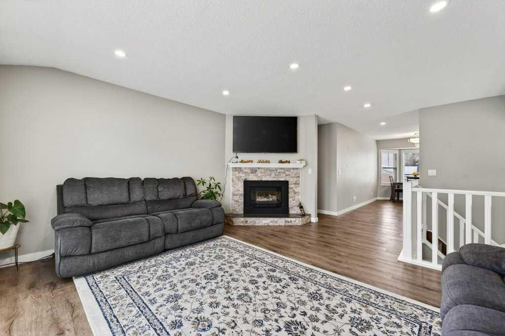 96 Templehill Drive Ne, Calgary, AB - Indoor Photo Showing Living Room With Fireplace