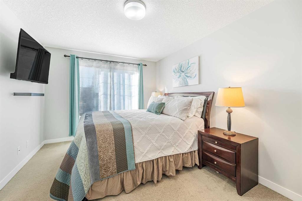 108 Jumping Pound Common, Cochrane, AB - Indoor Photo Showing Bedroom