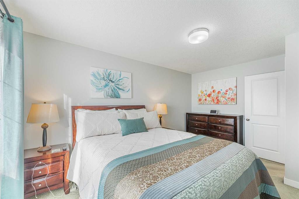 108 Jumping Pound Common, Cochrane, AB - Indoor Photo Showing Bedroom