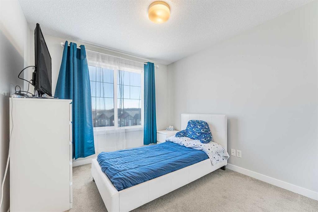 108 Jumping Pound Common, Cochrane, AB - Indoor Photo Showing Bedroom