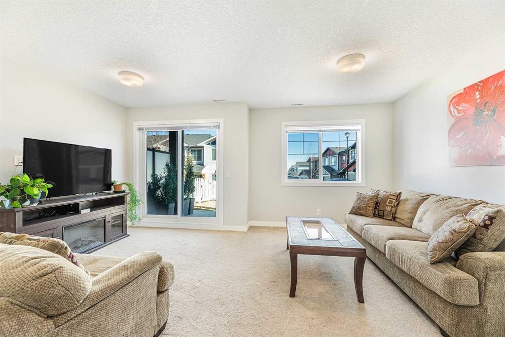 108 Jumping Pound Common, Cochrane, AB - Indoor Photo Showing Living Room