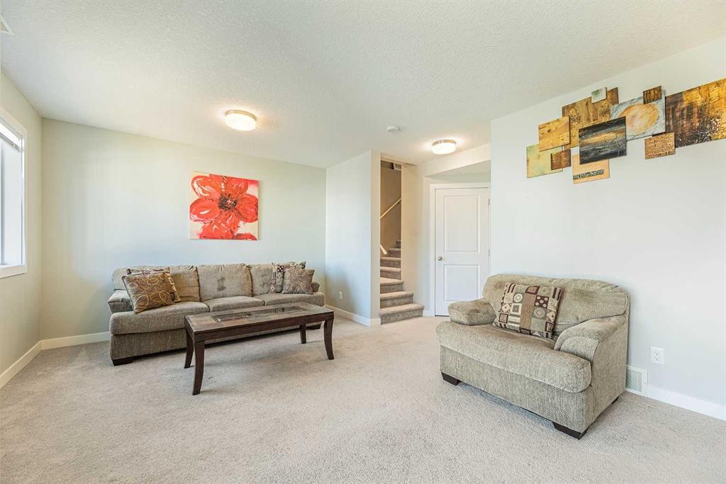 108 Jumping Pound Common, Cochrane, AB - Indoor Photo Showing Living Room