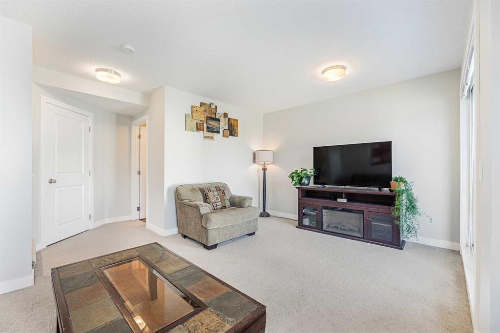 108 Jumping Pound Common, Cochrane, AB - Indoor Photo Showing Living Room
