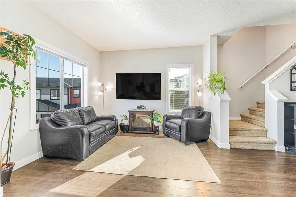 108 Jumping Pound Common, Cochrane, AB - Indoor Photo Showing Living Room