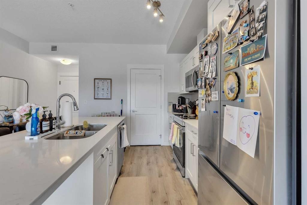 104-30 Sage Hill Walk Nw, Calgary, AB - Indoor Photo Showing Kitchen With Double Sink With Upgraded Kitchen