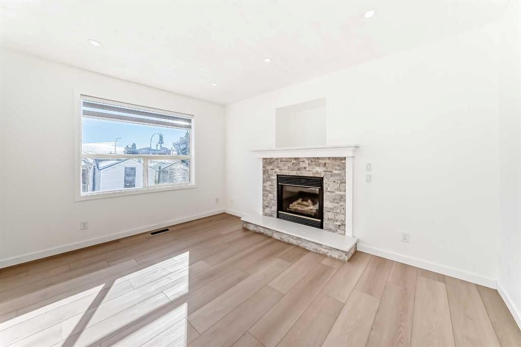 6 Arbour Stone Rise Nw, Calgary, AB - Indoor Photo Showing Living Room With Fireplace