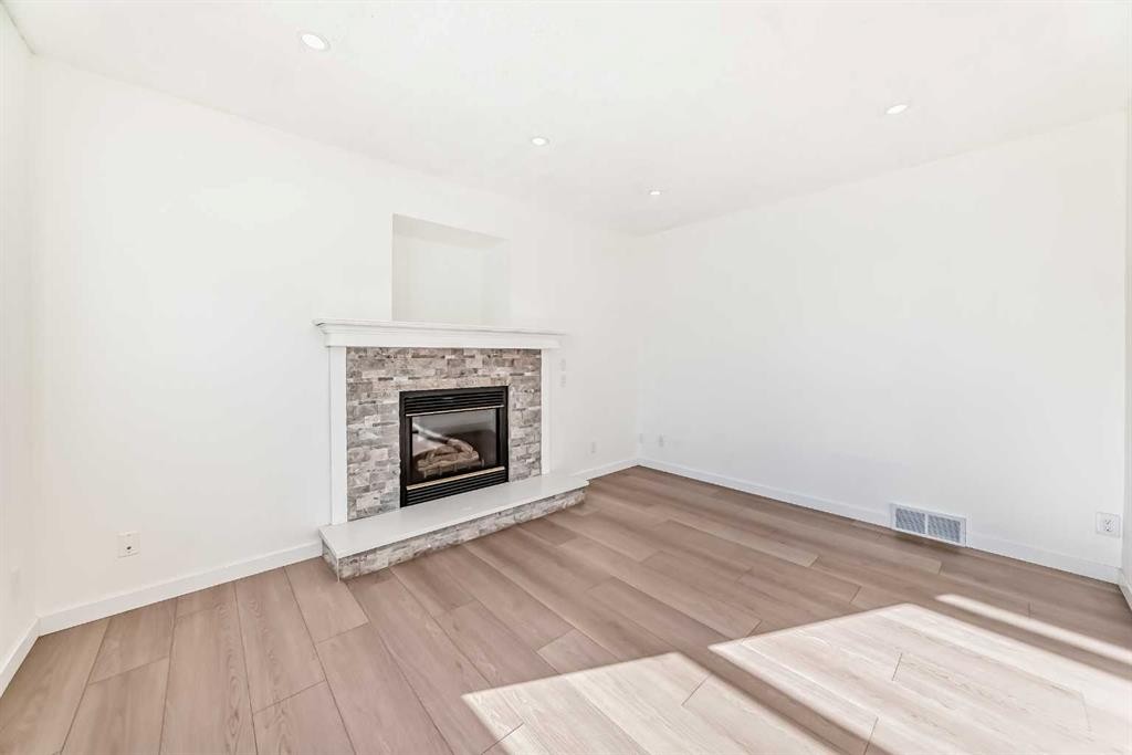 6 Arbour Stone Rise Nw, Calgary, AB - Indoor Photo Showing Living Room With Fireplace