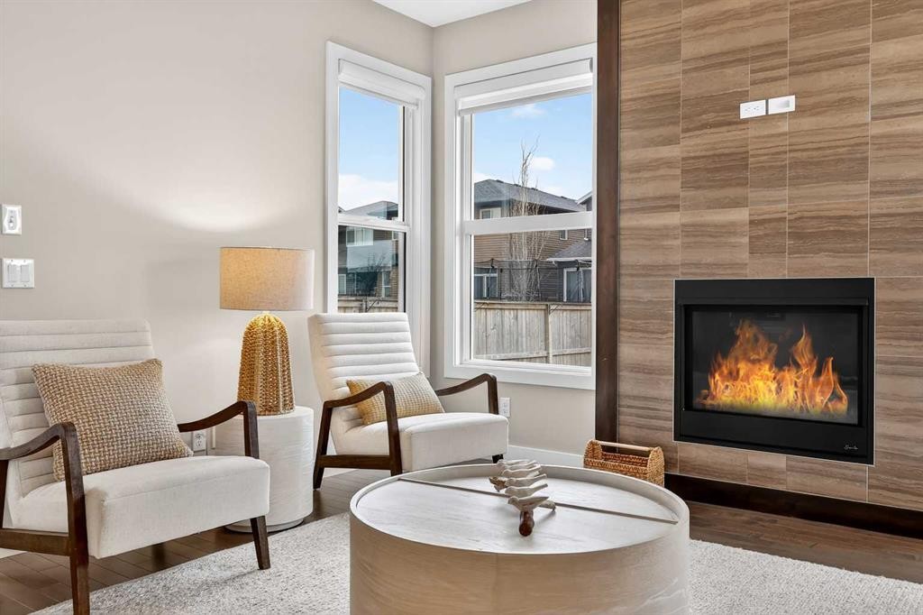 9 Legacy Lane Se, Calgary, AB - Indoor Photo Showing Living Room With Fireplace
