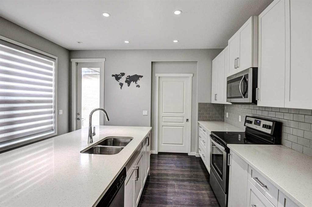 195 Masters Avenue Se, Calgary, AB - Indoor Photo Showing Kitchen With Stainless Steel Kitchen With Double Sink With Upgraded Kitchen