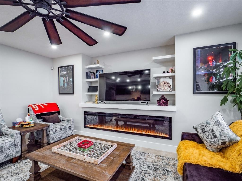 132 Belvedere Drive Se, Calgary, AB - Indoor Photo Showing Living Room With Fireplace