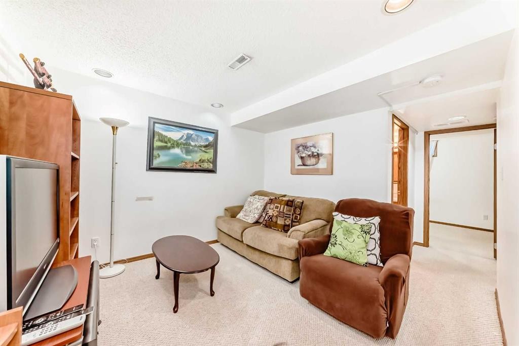 69 Applemont Place Se, Calgary, AB - Indoor Photo Showing Living Room