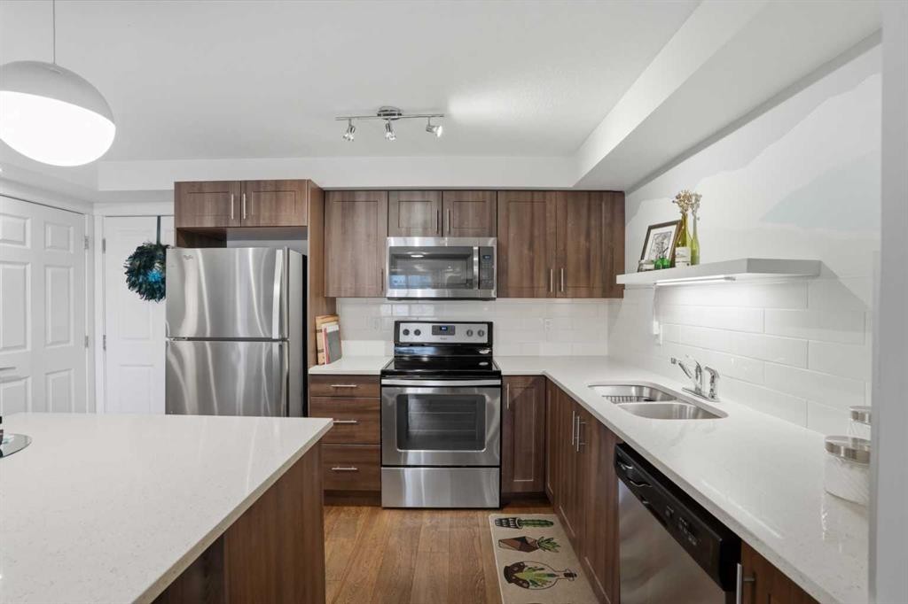 1117-99 Copperstone Park Se, Calgary, AB - Indoor Photo Showing Kitchen With Double Sink