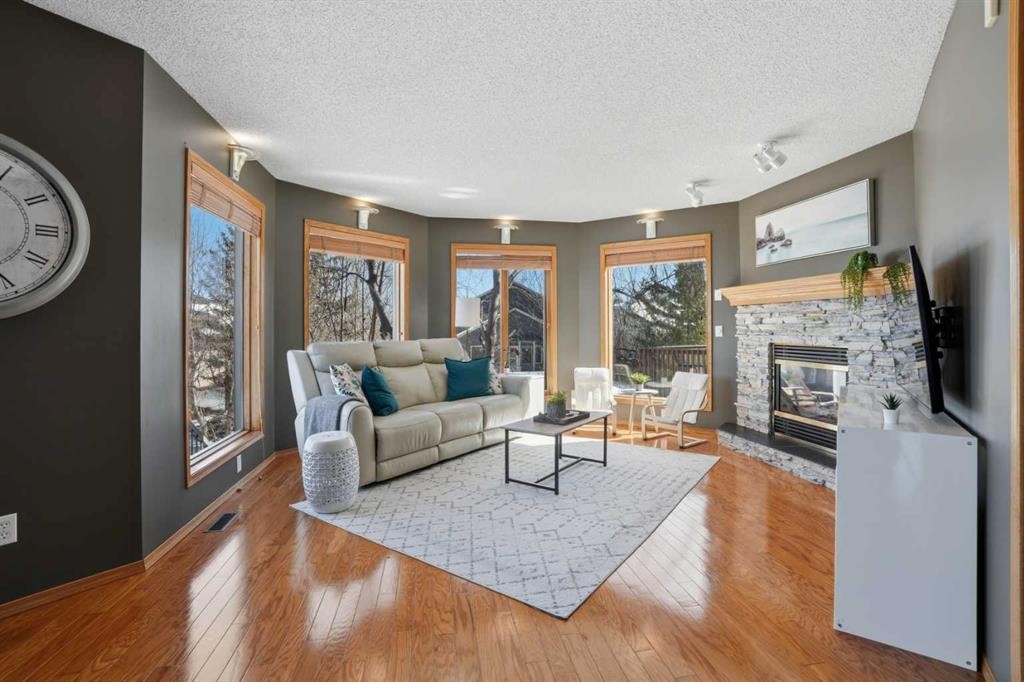 131 Edgebrook Circle Nw, Calgary, AB - Indoor Photo Showing Living Room With Fireplace