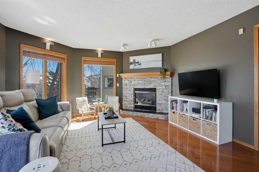 131 Edgebrook Circle Nw, Calgary, AB - Indoor Photo Showing Living Room With Fireplace