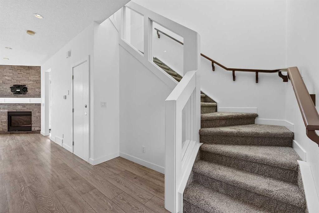 935 Regal Crescent Ne, Calgary, AB - Indoor Photo Showing Other Room With Fireplace