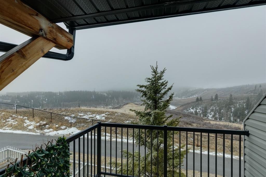 1502 Jumping Pound Common, Cochrane, AB - Outdoor With View With Exterior