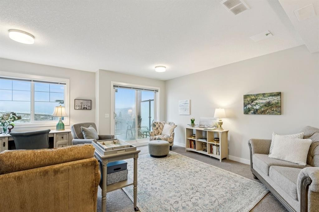 1502 Jumping Pound Common, Cochrane, AB - Indoor Photo Showing Living Room