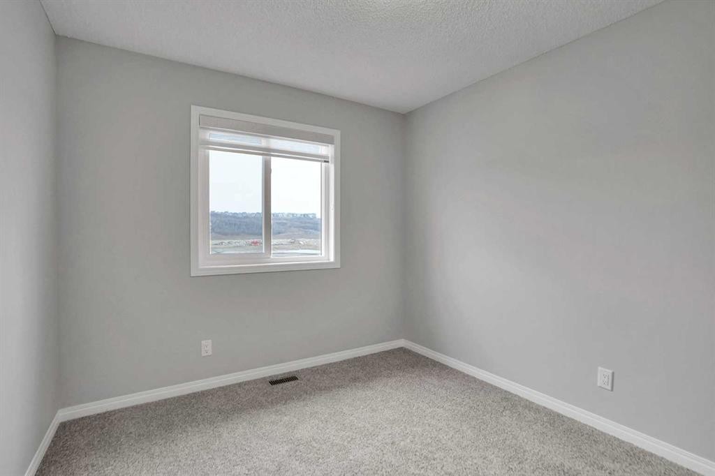 667 Wolf Willow Boulevard Se, Calgary, AB - Indoor Photo Showing Other Room