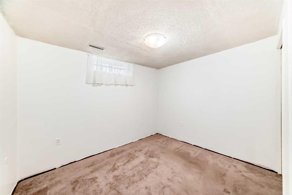 130 Pinemeadow Road Ne, Calgary, AB - Indoor Photo Showing Other Room
