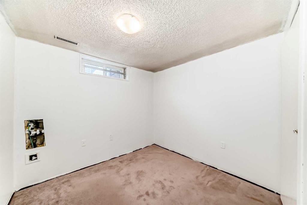 130 Pinemeadow Road Ne, Calgary, AB - Indoor Photo Showing Other Room